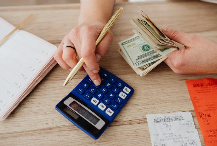 Person reviewing budget before spending