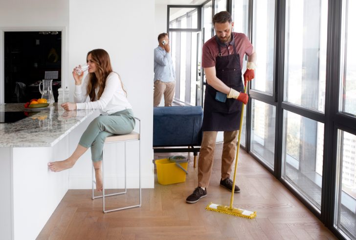 Person relaxing while cleaner works