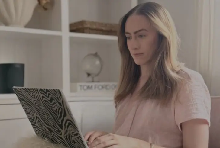 Woman planning finances with notebook.