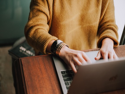 woman sweater typing content